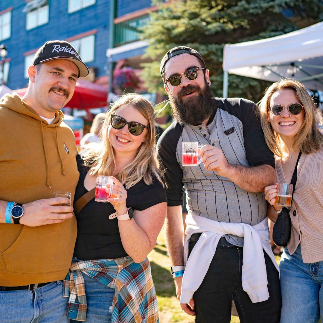 Friends sampling drinks outdoors at the Silver Star Beer and Cider Festival